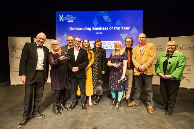 Outstanding Business of the Year Award. From the left, Host Harry Gration, the team from winner One to One Development Trust, and Joanne Taylor from Wakefield College.