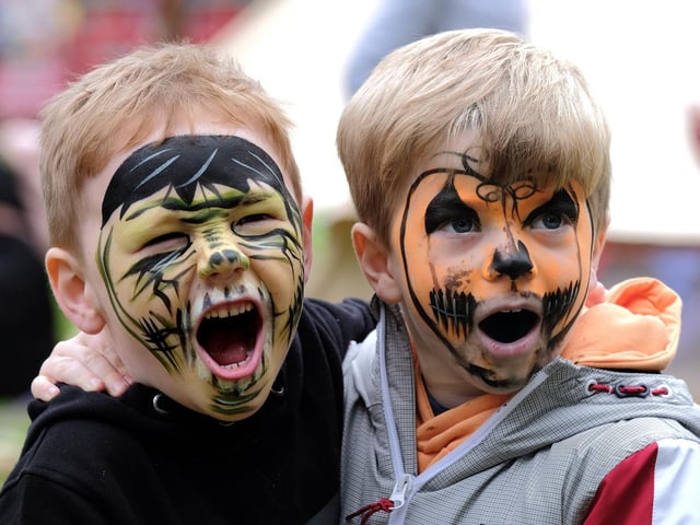 .Face paint super heroes Arthur and Rory.