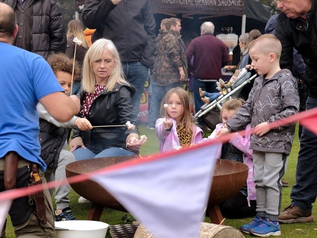 Enjoying toasting marshmallows.