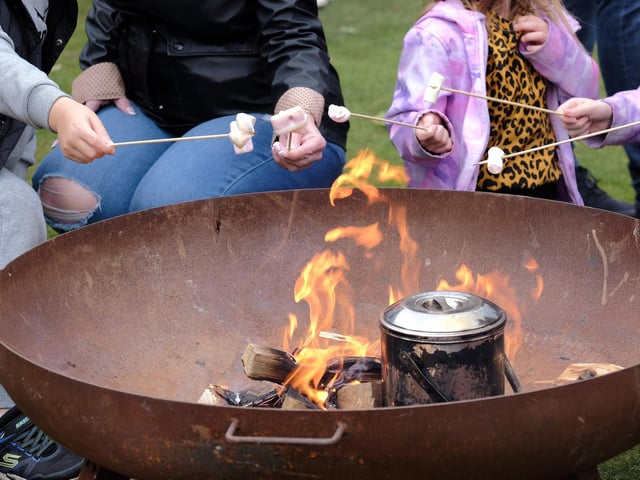 Toasting marshmallows by the open fire.