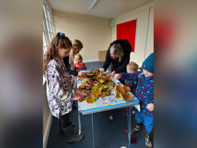 Children make leaf wreaths at Autumn Daze Festival.