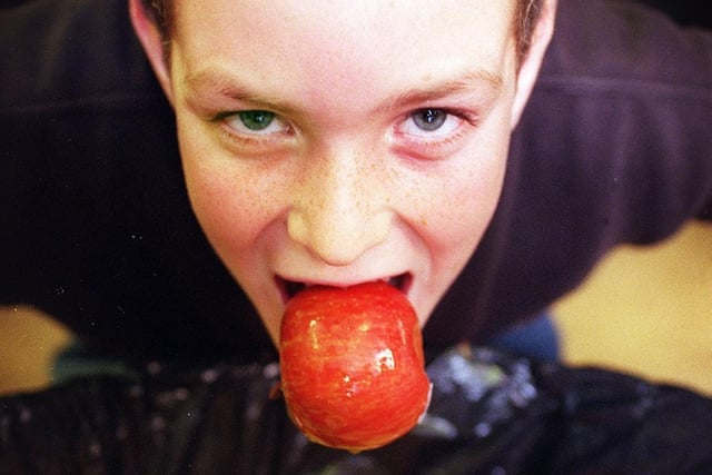 Twelve year old Chris Banks of Poulton, bobbing for apples