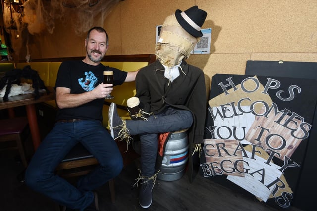 Phil Binks with scarecrow called Hops, welcoming customers to Crafty Beggars, Fulwood.