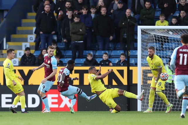 Maxwel Cornet of Burnley scores their team's third goal during the Premier League match between Burnley and Brentford at Turf Moor on October 30, 2021 in Burnley, England.