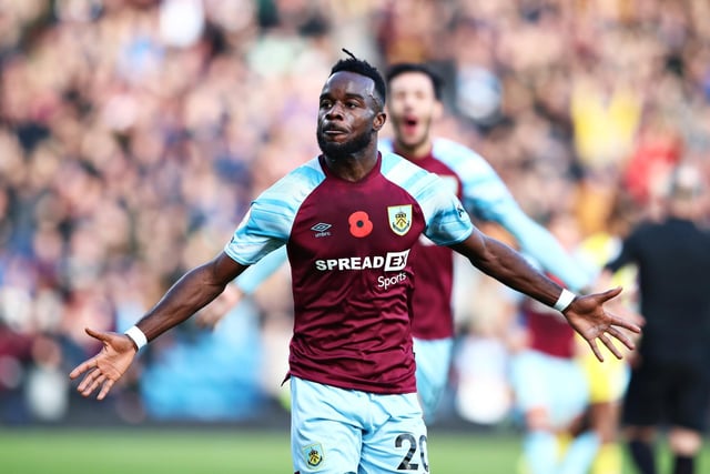 Maxwel Cornet of Burnley celebrates after scoring their team's third goal during the Premier League match between Burnley and Brentford at Turf Moor on October 30, 2021 in Burnley, England.