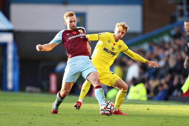 Charlie Taylor of Burnley battles for possession with Mads Roerslev of Brentford during the Premier League match between Burnley and Brentford at Turf Moor on October 30, 2021 in Burnley, England.