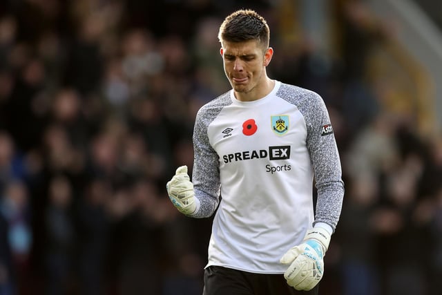 Nick Pope celebrates after Maxwel Cornet of Burnley (not pictured) scores their teams third goal during the Premier League match between Burnley and Brentford at Turf Moor on October 30, 2021 in Burnley, England.