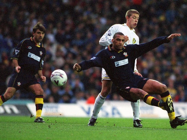 Alan Smith brings down Southampton's Dean Richards.