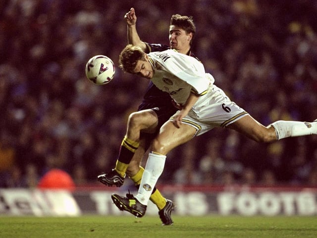 Jonny Woodgate heads the ball clear under pressure from Southampton's Marian Pahars.