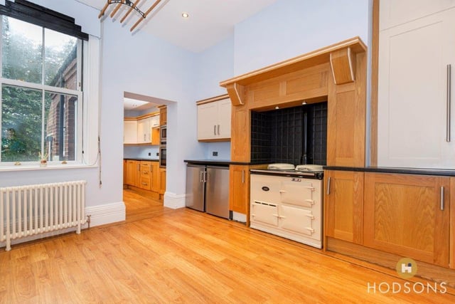 This room has matching oak units with the kitchen.