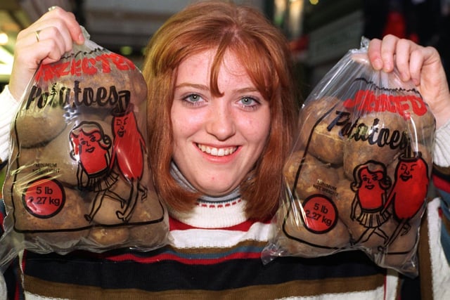 Sharon Wood, an assistant at M &G Fruits pictured in September 1995 with bagged potatoes marked in 5lb and 2.27kg.