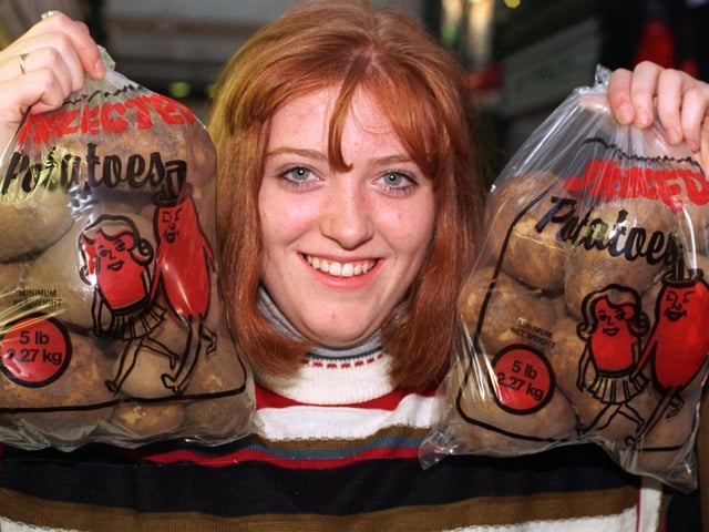 Sharon Wood, an assistant at M &G Fruits pictured in September 1995 with bagged potatoes marked in 5lb and 2.27kg.