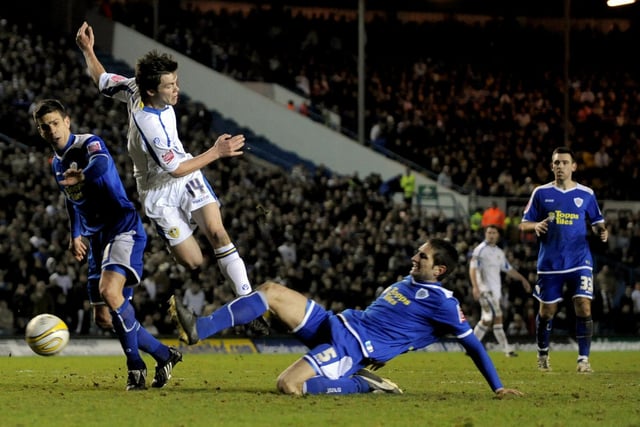 Jonny Howson is brought down just outside the box by Leicester City's Bruno Berner (left) and Aleksander Tunchev (right).