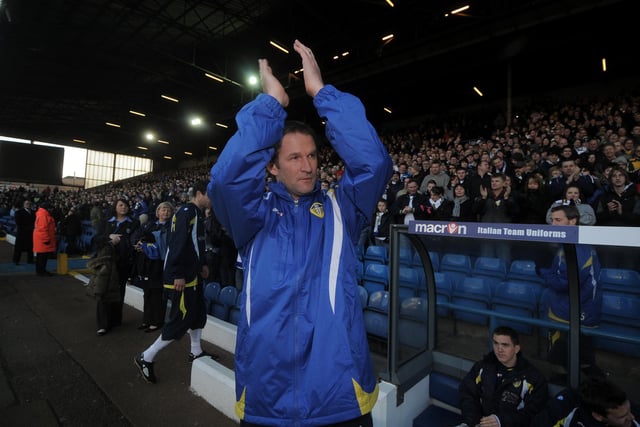 Simon Grayson walks out onto the pitch for his first game in charge.