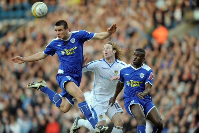 Luciano Becchio gets blocked in by Leicester City's Jack Hobbs and Kerra Gilbert.