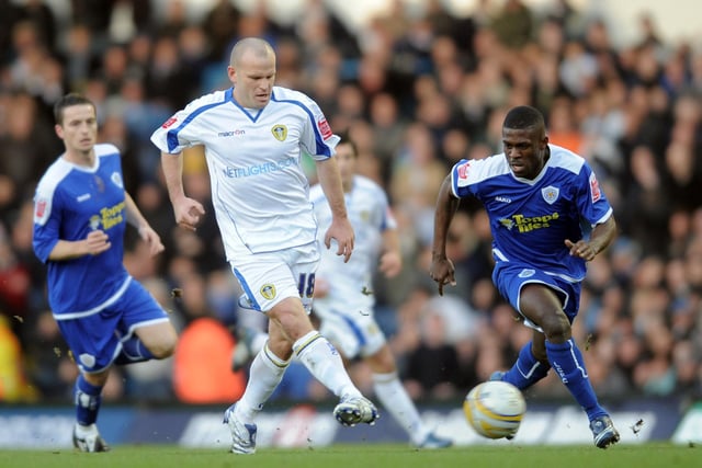 Andy Robinson passes the ball on as Leicester City's Kerra Gilbert moves in.