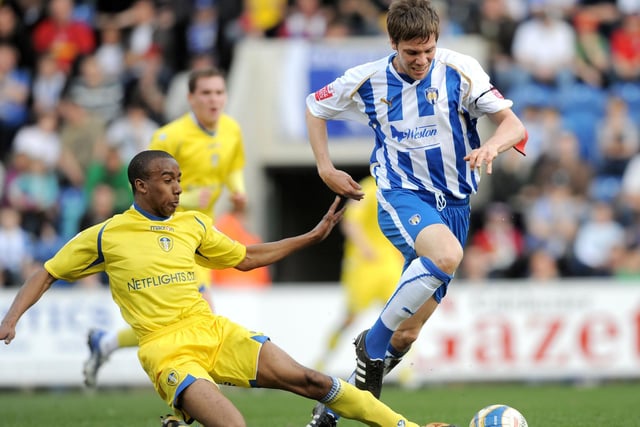 Fabian Delph gets a foot in on Colchester United's Dean Hammond during the League One clash at the Community Stadium in April 2009.