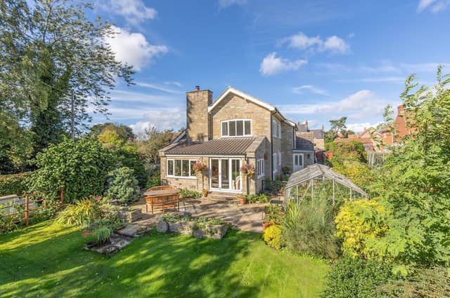 Stunning gardens and a wide patio for dining or sitting outside.