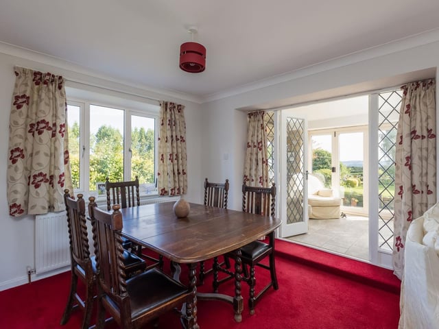 The dining room leads through to the garden room beyond.