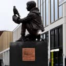 The Barry Hines Kes Statue is put in place at Cheapside, Barnsley - Graham Ibbeson is pictured with his sculpture  Picture: Simon Hulme