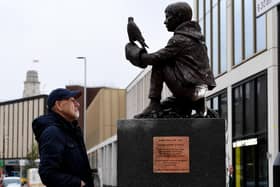 The Barry Hines Kes Statue is put in place at Cheapside, Barnsley - Graham Ibbeson is pictured with his sculpture Picture: Simon Hulme