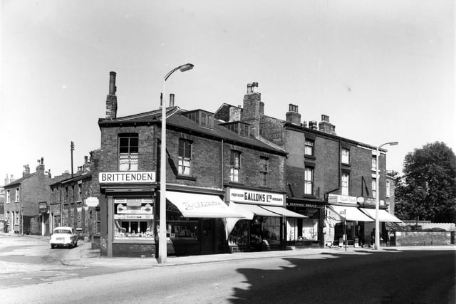 August 1961 and pictured is a row of shops on Woodhouse Street part of Hyde Park Corner. Businesses include provision merchants Gallons Ltd as well as a newsagents and stationers run by A.W. and N. Spence.