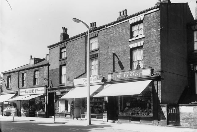 A row of shops on Woodhouse Street pictured in August 1961. Shops include Gallons Ltd, grocers and the Hyde Park Fruit Stores.