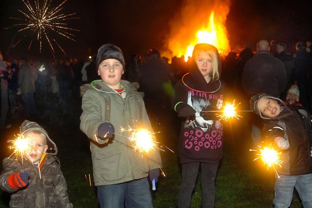Enjoying the bonfire in 2010 are Adam Munt, Liam Munt, Sophie Murphy and Ewan Murphy