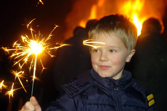 Eight-year-old Caleb Bates gets to grips with one of his sparklers in 2018