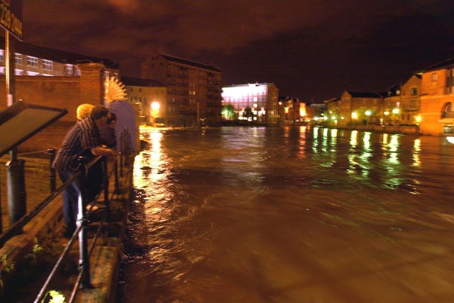 Heavy rain brought fears of city centre flooding. Pictured is the River Aire in full flow below Leeds Bridge.