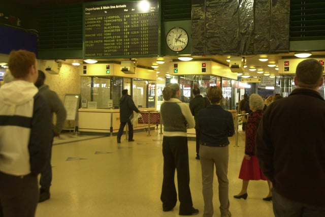 Travellers check the timetable at Leeds City Station as train delays continued throughout the region.