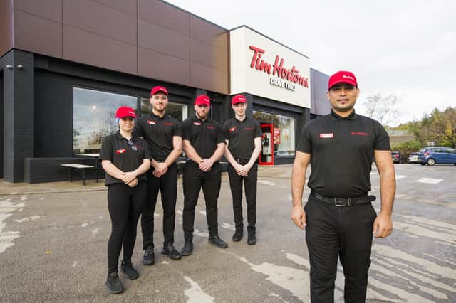 Pictured at the new Tim Hortons drive thru in Birstall are, from the left, Eve Pendlebury, Noah Arif, manager Luke Powell, Tom Kavanagh and store manager Mohan Bhatt