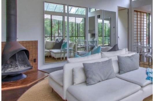 Experience a classic Californian existence in this beautiful zen-like home that’s only a five-minute walk to Carmel’s enchanting village centre. With world-class dining, shopping, activities and gorgeous white sand beaches all within half a mile, it’s a little dose of heaven! Connect with nature as you look out of the living room’s floor-to-ceiling windows, sit in the glass sunroom that’s surrounded by the trees, or relax by the wood-burning fireplace.
