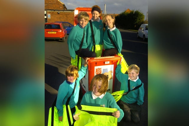 Pupils at East Whitby School get recycling bags.