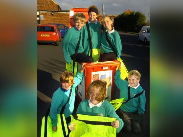 Pupils at East Whitby School get recycling bags.