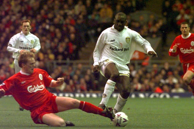 Jimmy Floyd Hasselbaink skips over the challenge from Liverpool's Steve Staunton.