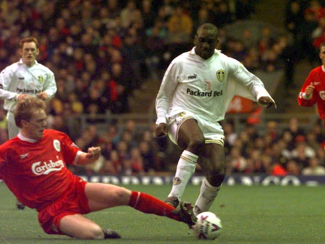 Jimmy Floyd Hasselbaink skips over the challenge from Liverpool's Steve Staunton.