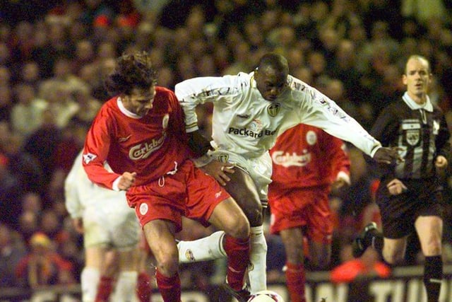 Jimmy Floyd Hasselbaink goes toe to toe with Liverpool's Patrick Berger.