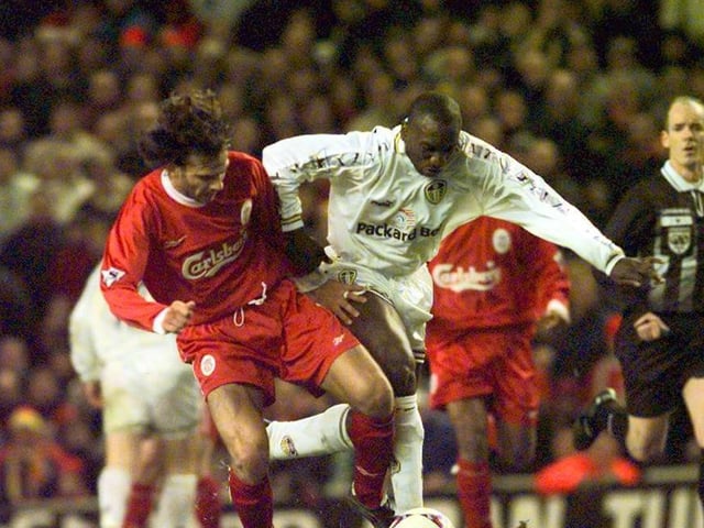 Jimmy Floyd Hasselbaink goes toe to toe with Liverpool's Patrick Berger.