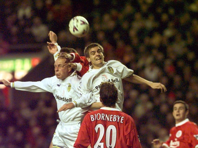 Robert Molenaar and Jonathon Woodgate rise high to clear the danger of a Liverpool attack.