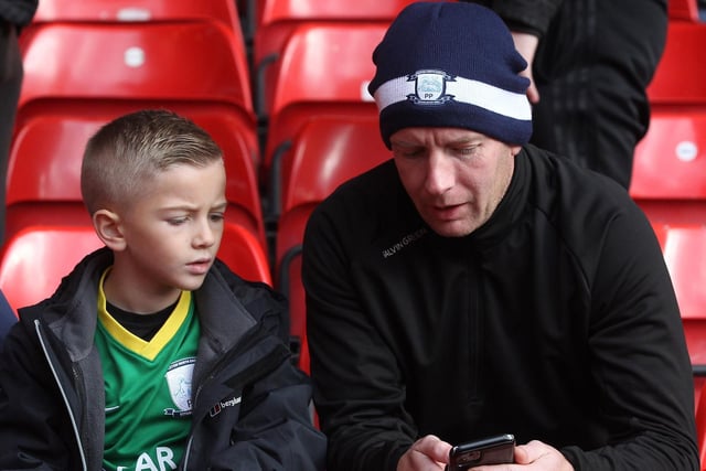 Two PNE fans check the phone at Nottingham Forest