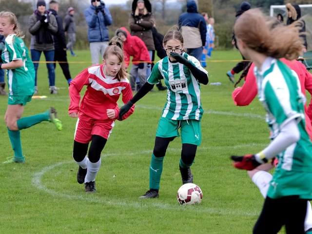 Scarborough's Emily Fawthrop puts pressure on a Wigginton defender

Photo by Richard Ponter