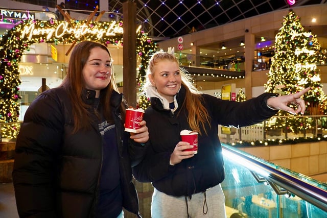 Festive cheers - Niamh Naughton, left, and Daisy Edwards, both from London and studying in Leeds, are the first to enjoy a drink at the new ski bar