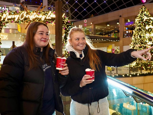 Festive cheers - Niamh Naughton, left, and Daisy Edwards, both from London and studying in Leeds, are the first to enjoy a drink at the new ski bar