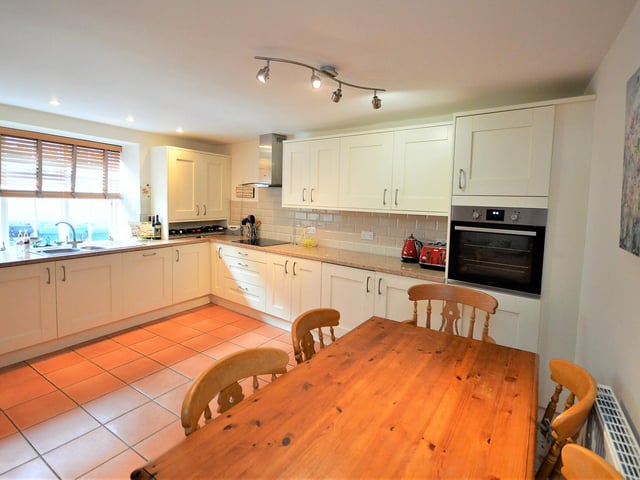 Fitted units provide plenty of storage space in the dining kitchen.
