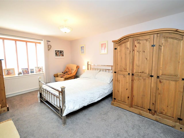 One of the bedrooms with free standing furniture within the Lees Yard cottage.