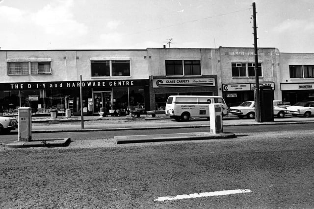 A parade of shops on Dewsbury Road in July 1980. On the left is a double fronted D.I.Y and hardware centre, then Class Carpets, the business of Mr. K. Jones. Moving right a credit lending service and then a washeteria laundrette.