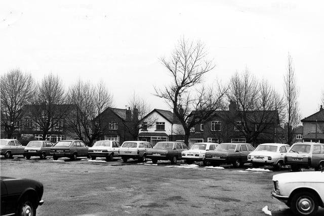 Old Lane looking from a car park towards housing across the road in February 1980.