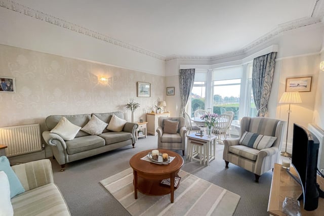 There is plenty of natural light from the large bay window in this main reception room.