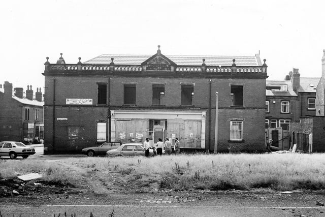The front view of the former Leeds Industrial Co-operative Society Building at number 1 Hardy Street in July 1984.  A decorative gable on the roof has a datestone of 1897.